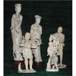 A Japanese ivory figure depicting a sweeping boy with playful monkey on his...