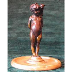 A charming early 20th century bronze figure of an overweight child with a cat...