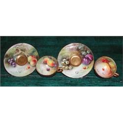 Two Royal Worcester cups and saucers painted with fruit, one cup signed Cole,...
