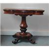 Image 1 : A Victorian rosewood tea table with shaped fold-over swivel top on pedestal...
