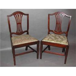 A set of six Georgian mahogany Hepplewhite style dining chairs with pierced...