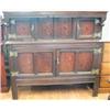 A 17th century and later inlaid oak court cabinet with two small panel doors...