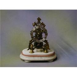 A 19th/20th Century 8 day fusee skeleton clock raised on an oval marble base with glass dome (f)...