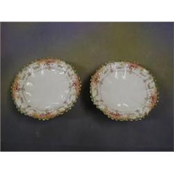 A pair of Victorian Langton porcelain tazzas of circular form raised on 3 hoof supports 9" (1 cra...