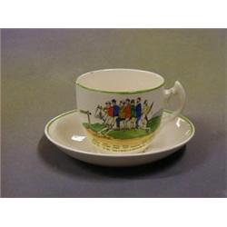 A Dartmoor pottery cup and saucer "Off To Widdecombe Fair" £5-10...
