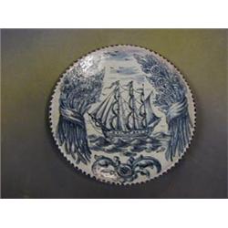 A 20th Century "Delft" charger decorated a galleon and marked AN 11" £20-30...