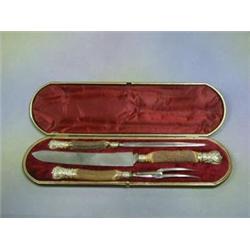 A Victorian 3 piece carving set with stag horn handles contained in a leather case £20-30...