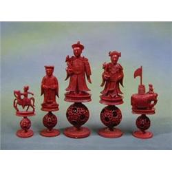 A fine quality Oriental 28 piece red and white carved ivory chess set comprising red - Emperor (f...