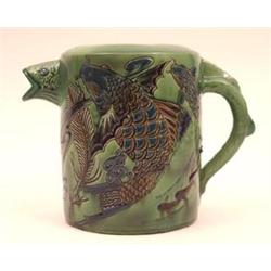 A Green Glazed Brannum Ware Jug, incised with...