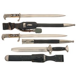 Three Nazi German Edged Weapons Including a Red Cross Enlisted Knife and Two Nazi Police Daggers