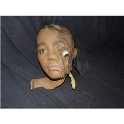 SILICONE SEVERED GIRL HEAD WITH DROOPY EXPOSED EYE