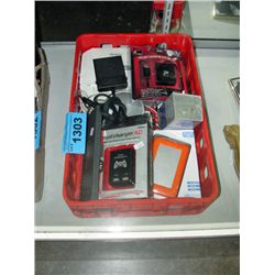 Red plastic storage box filled with assorted