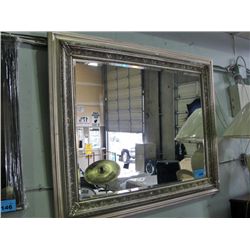 Bevelled and framed mirror