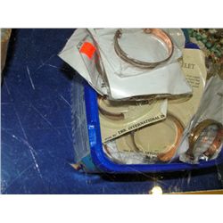 Box full of assorted magnetic bracelets