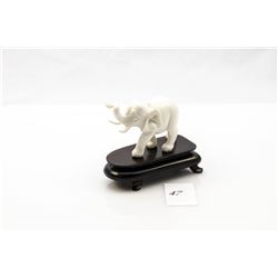 Genuine ivory carved elephant figurine on small