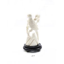 Genuine ivory carved bird figurine on wooden stand