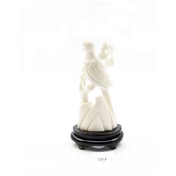 Genuine ivory carved bird figurine on wooden stand