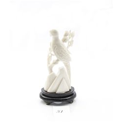 Genuine ivory carved bird figurine on wooden stand