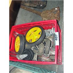 Red milk crate filled with assorted casters