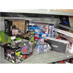 Shelf lot of radio controlled cars and helicopters