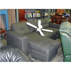 Grey upholstered sectional sofa with extended