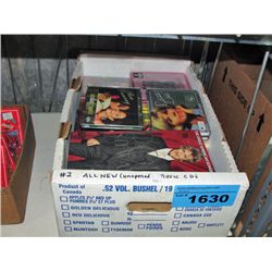 Box of assorted music CDs