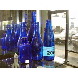 Collection of 5 blue glass bottles