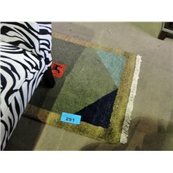 Small hand knotted wool throw rug