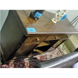 Oak finish dining room buffet with wine bottle