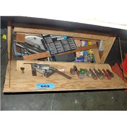 Wooden tool cabinet filled with assorted tools