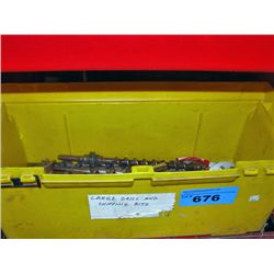 Yellow toolbox with assorted large drill bits