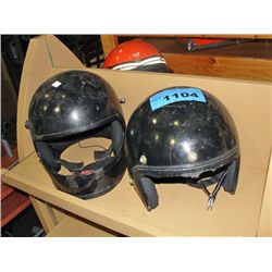 2 black motorcycle helmets