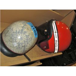 2 motorcycle helmets; orange and cream colored