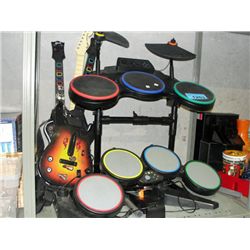 Shelf lot of rockband guitars and drums et