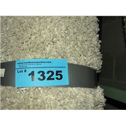 Small off white shag area rug