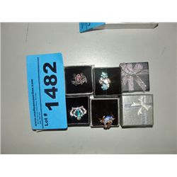 Lot of 4 rhinestone jeweled rings