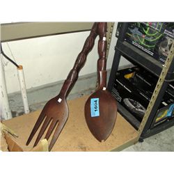 Large carved wooden fork and spoon set
