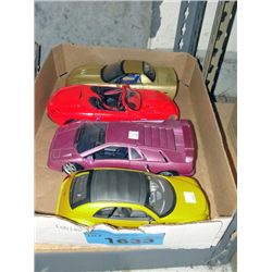 4 diecast metal collectors cars