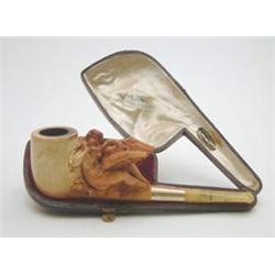 A Victorian Meerschaum pipe carved with a nude woman at play with a swan, gold mounted mouthpiece...