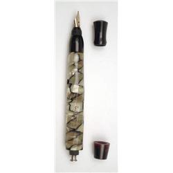Skinex fountain pen of unusual design with black and pearl twisted faceted body and warranted nib...