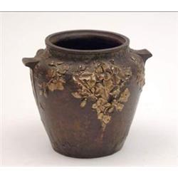 A 19th century French miniature bronze vase cast with gilded foliage, stamped Louchet, Paris, Cis...