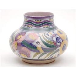 A Carter, Stabler and Adams Poole pottery vase of bellied shape brightly painted with stylised fl...