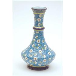 A Longwy, France earthenware vase thickly enamelled with daisies against a blue cloisonne effect...