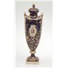 Image 1 : A Mintons bone china vase and cover, urn-shaped with gilded handles, painted with a bouquet of fl...