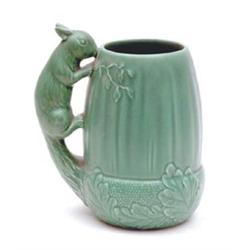A Sylvac type green glazed vase of acorn shape with squirrel handle, 8ins £60-80...