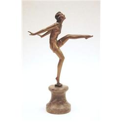 An Art Deco bronze figure of a female dancer with one leg raised, gold patination, on waisted mar...