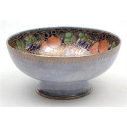 A Royal Worcester Crown Ware fruit bowl painted and gilded with fruit against a mottled blue-gree...