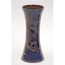 A W.L.Baron, Barnstaple blue-glazed vase of waisted form, incised and painted with a fish and sur...