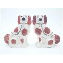 A pair of Victorian style comforter spaniels, coloured in rust enamel, 11ins £100-150...