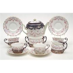 A silver-mounted Royal Doulton 11-piece teaset including teapot, milk jug and sugar bowl, silver...